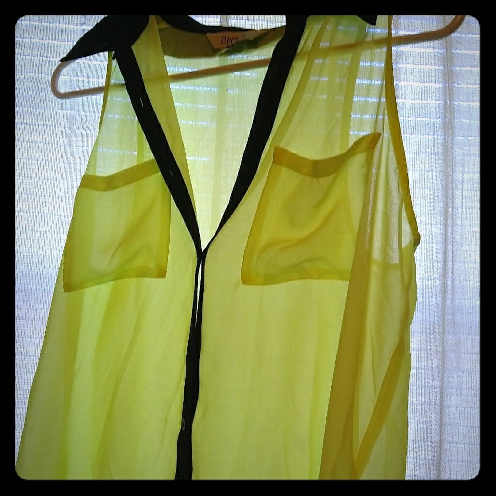 Bright yellow and black top.